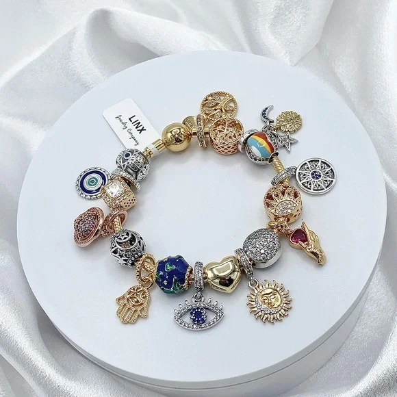Linx Gold Snake Chain Bracelet with Universe Hamsa and Evil Eye Themed Charms